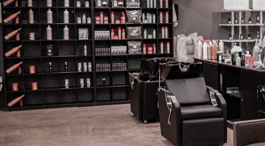 Modern salon interior at AlWaha 30 Degrees, Riyadh, منطقة الرياض, SA, featuring sleek styling chairs and product shelves.