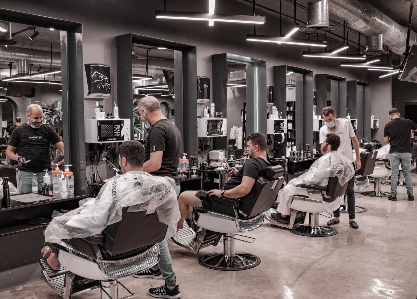 Stylish barbershop interior at AlWaha 30 Degrees, Riyadh, منطقة الرياض, SA offering upscale grooming services.