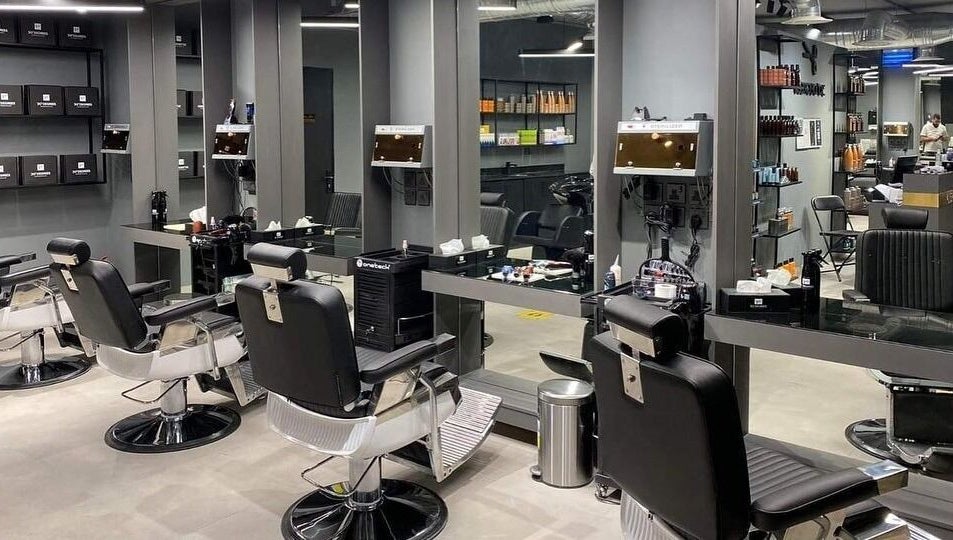 Sleek salon interior at Al Malqa 30 Degrees, Riyadh, SA. Featuring modern styling chairs and mirrors.