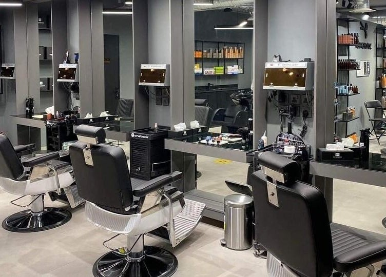 Sleek salon interior at Al Malqa 30 Degrees, Riyadh, SA. Featuring modern styling chairs and mirrors.