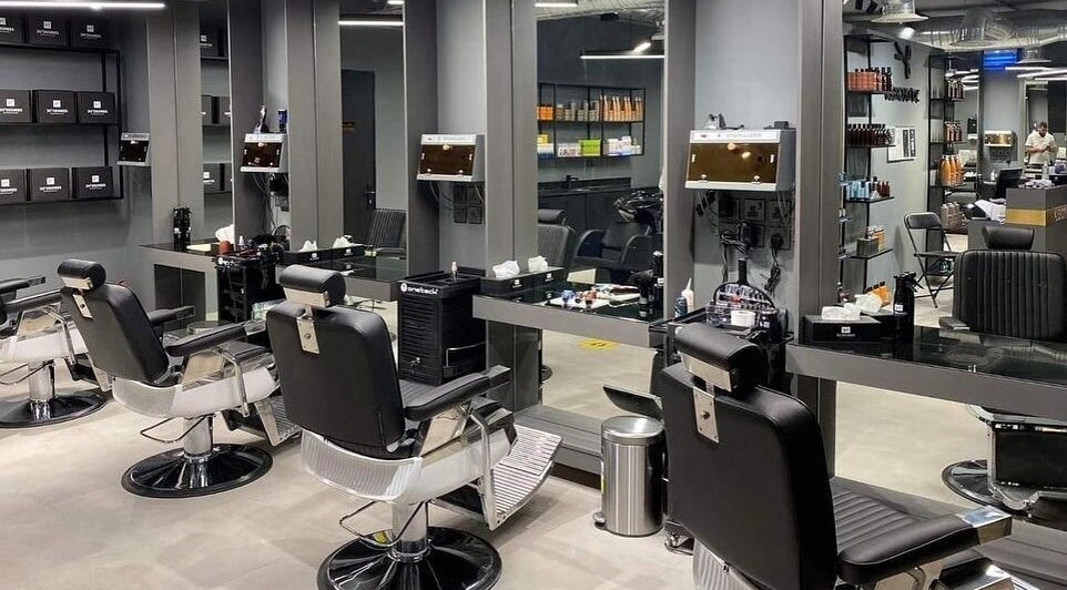 Sleek salon interior at Al Malqa 30 Degrees, Riyadh, SA. Featuring modern styling chairs and mirrors.