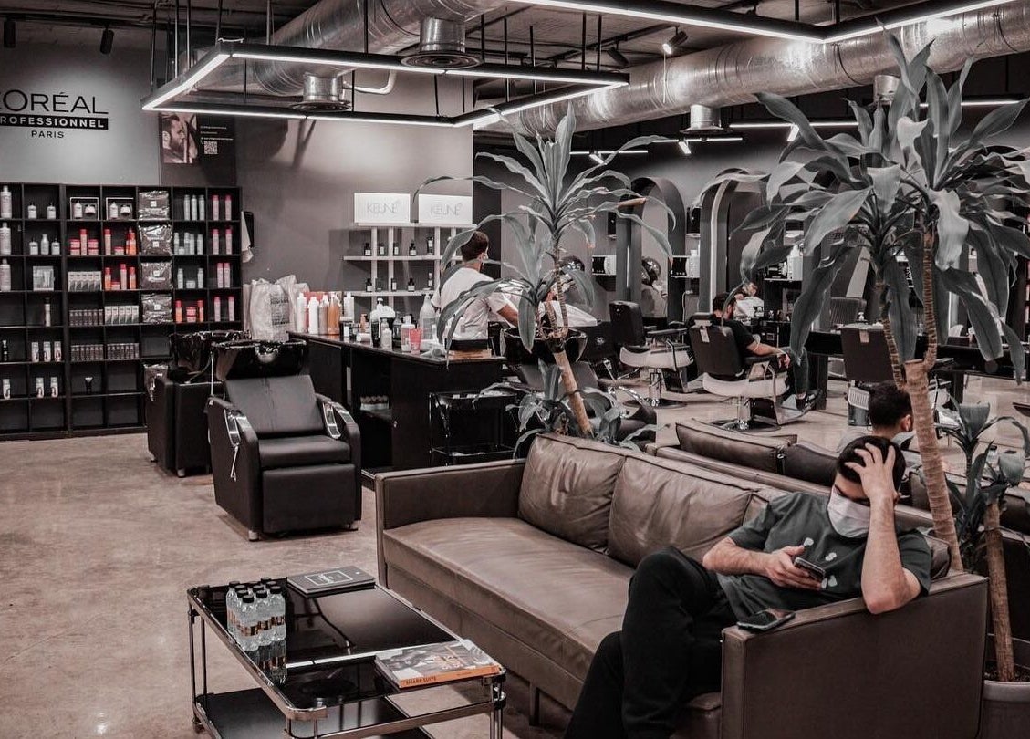 Interior of Al Malqa 30 Degrees salon in Riyadh, showcasing plush seating and stylish hair service stations.