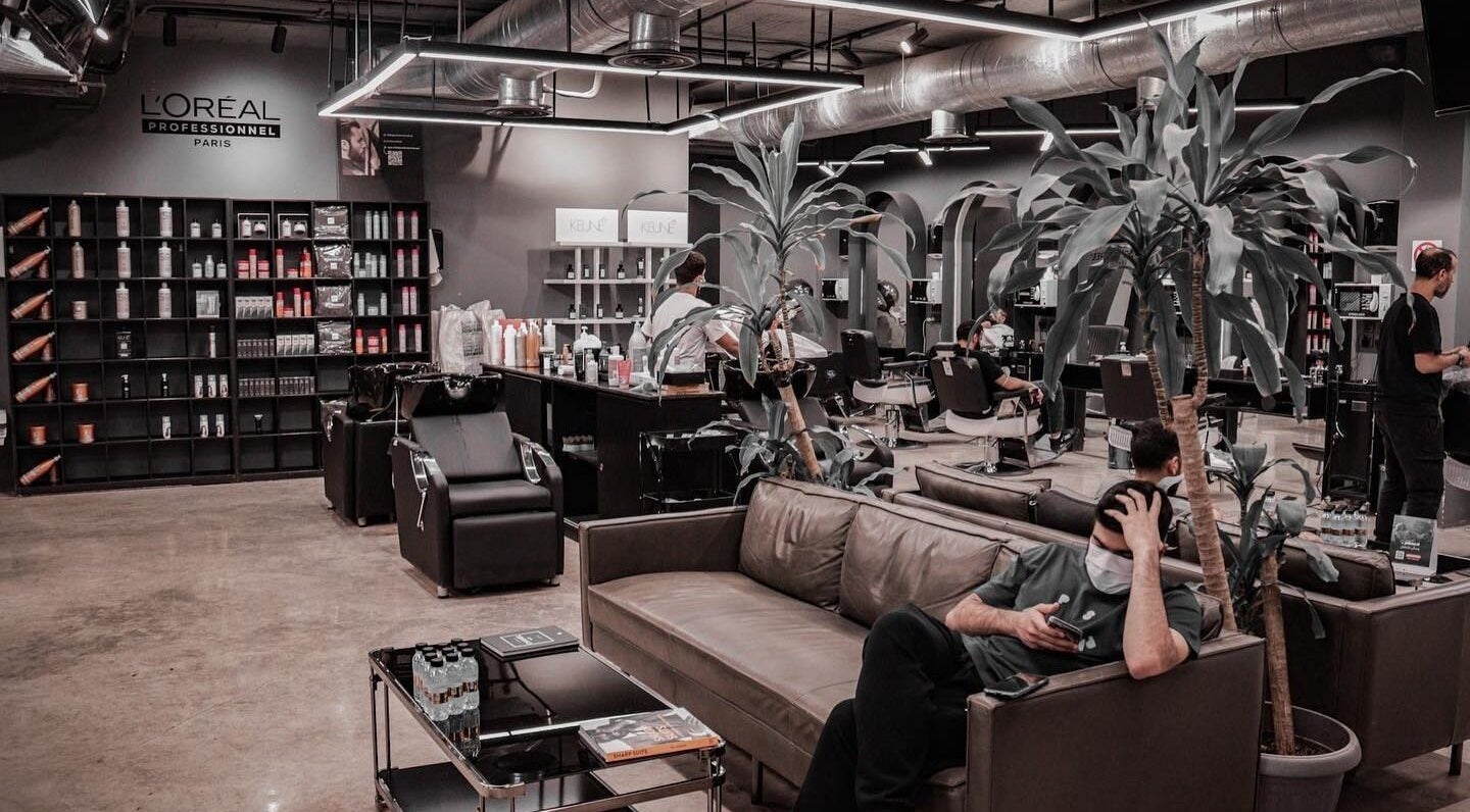 Interior of Al Malqa 30 Degrees salon in Riyadh, showcasing plush seating and stylish hair service stations.