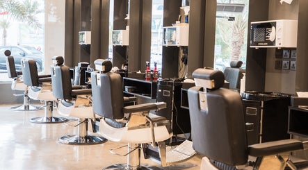 Chic salon interior at 30 Degrees Clock Tower, Makkah, Makkah Province, SA featuring modern chairs and mirrors.