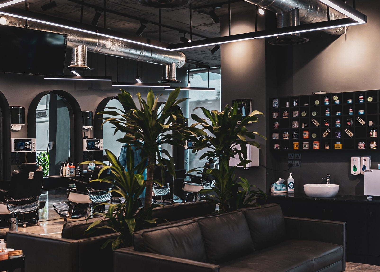 Luxurious salon interior at 30 Degrees Clock Tower in Makkah, Makkah Province, SA with sleek furniture and greenery.