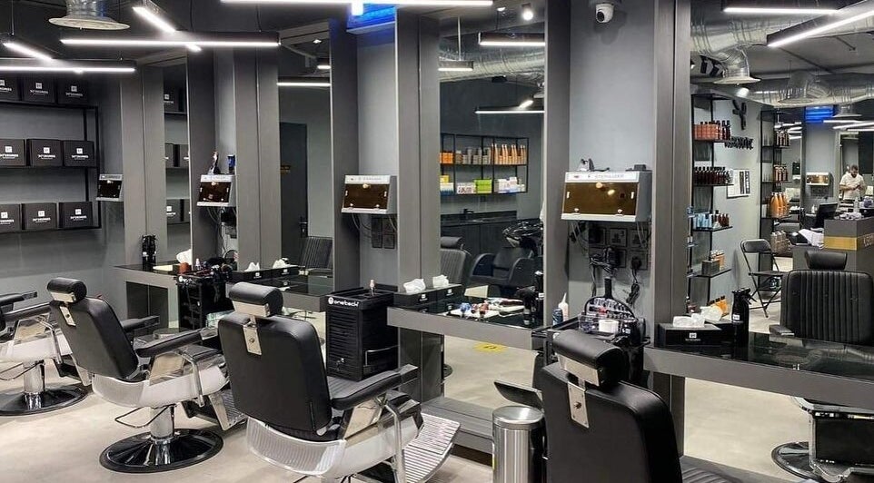 Modern salon at Al Aarid | 30 Degrees, Riyadh, Riyadh Province, SA showcasing sleek styling chairs and tools.