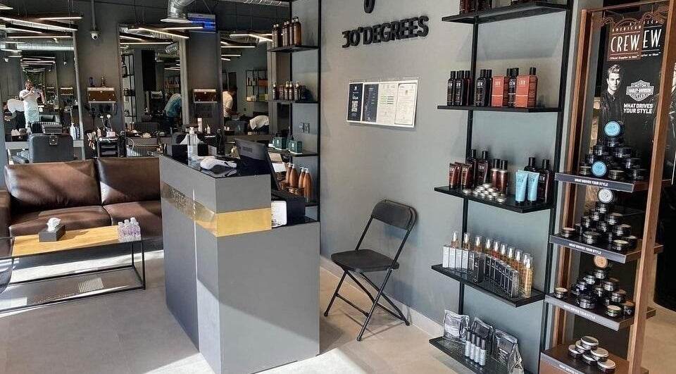 Modern salon lobby at Al Aarid | 30 Degrees, Riyadh, Riyadh Province, SA showcasing sleek design and product displays.