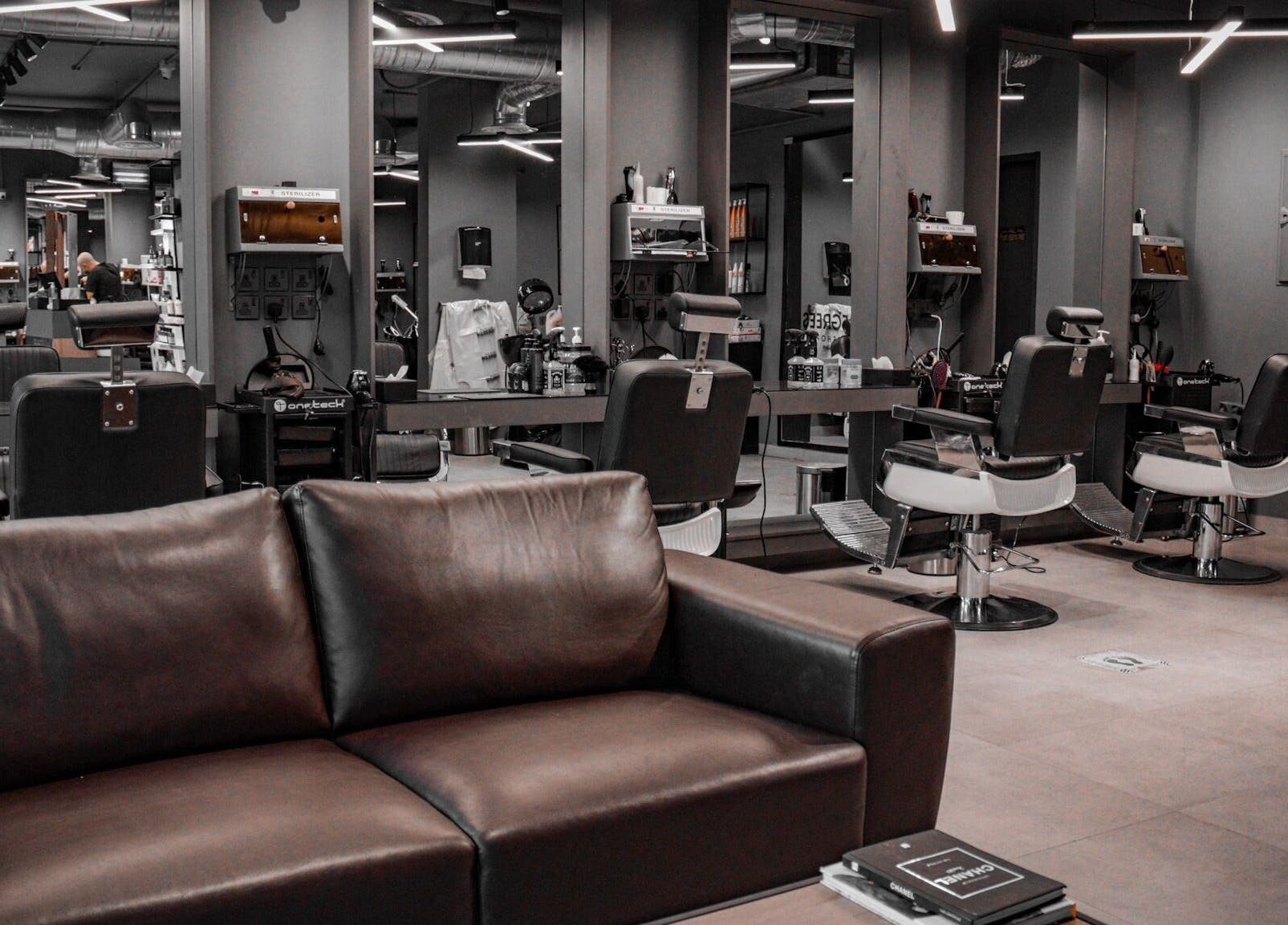 Chic barber chairs in Al Aarid | 30 Degrees salon, Riyadh, Riyadh Province, SA. Modern decor and mirrors.