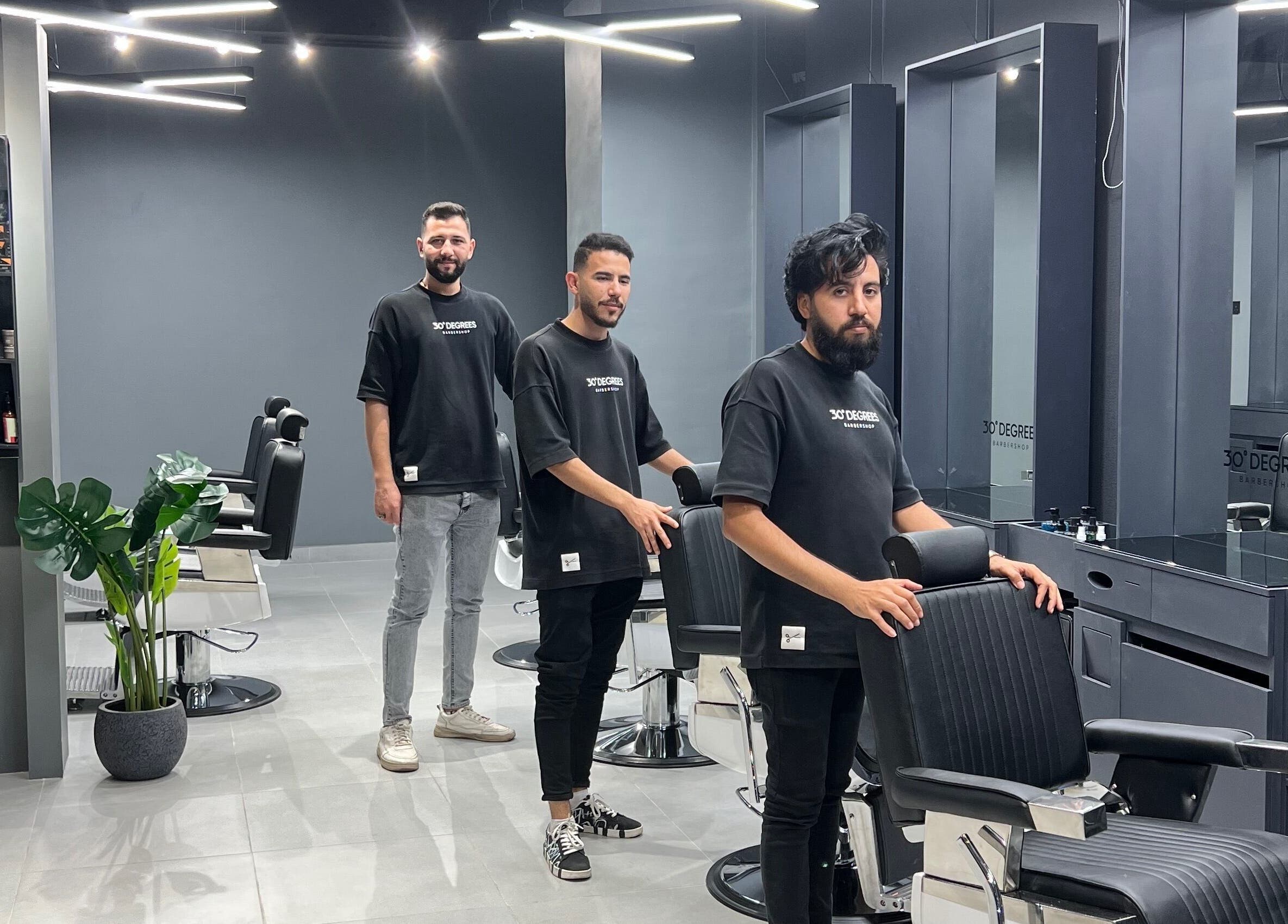 Stylish barbers at Jeddah 30 Degrees Alnaeem, Jeddah, Makkah Province, SA showcasing modern salon interior.