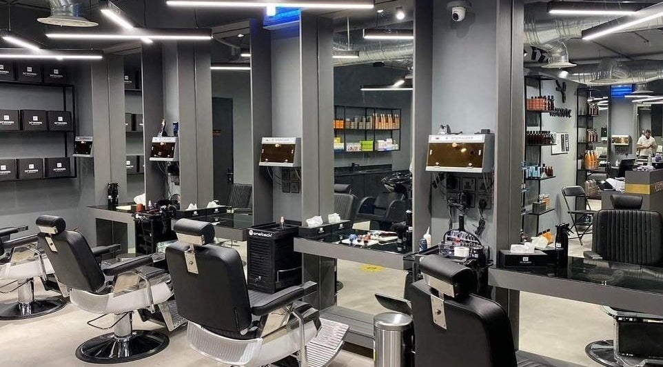 Modern salon interior at AlYasmin 30 Degrees, Riyadh, Saudi Arabia, SA featuring sleek chairs and mirrors.