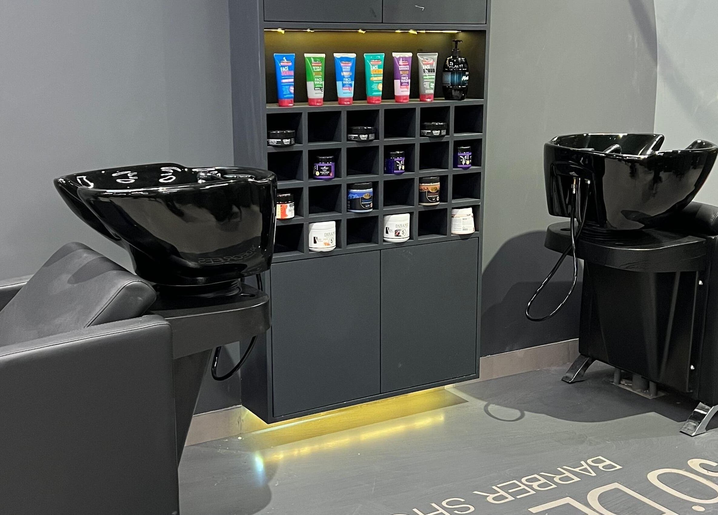 Modern shampoo station at 30Degrees Qirawan in Riyadh, Riyadh Province, SA with stylish black fixtures.