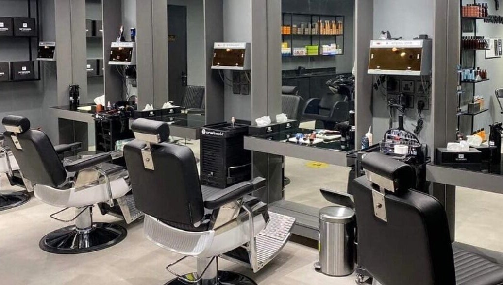 Modern salon interior at AL Falah 30 Degrees in Riyadh, Riyadh Province, SA, featuring sleek black chairs.