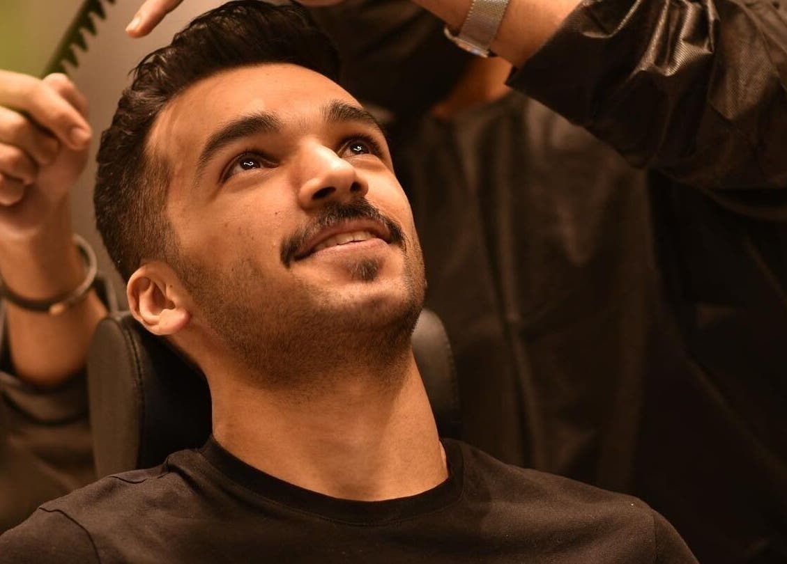 Man receiving haircut at ✂️ خدمه الحلاقة المنزلية – Home Services, Riyadh, Riyadh Province, SA.