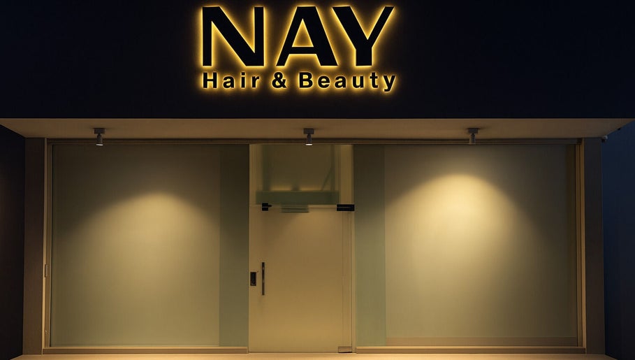 NAY SALON entrance at night in Riyadh, Riyadh Province, SA, highlighting its chic and modern exterior.
