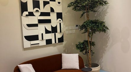 Stylish lounge area at NAY SALON, Riyadh, Riyadh Province, SA with modern art and lush greenery.