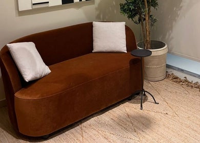 Cozy brown couch in NAY SALON, Riyadh, Riyadh Province, SA, enhancing serene ambiance with decor.