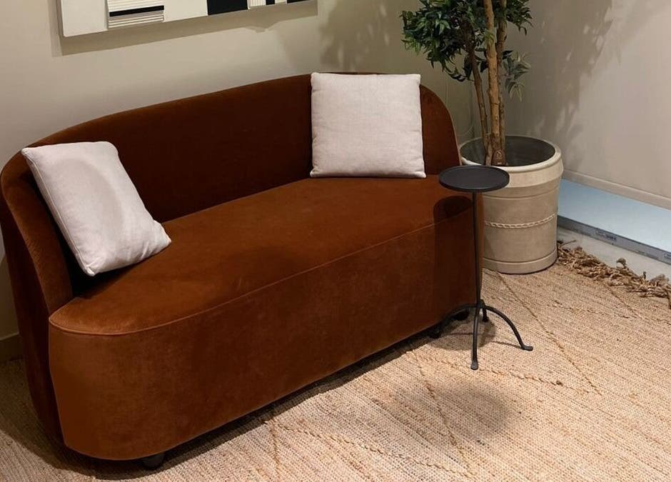 Cozy brown couch in NAY SALON, Riyadh, Riyadh Province, SA, enhancing serene ambiance with decor.