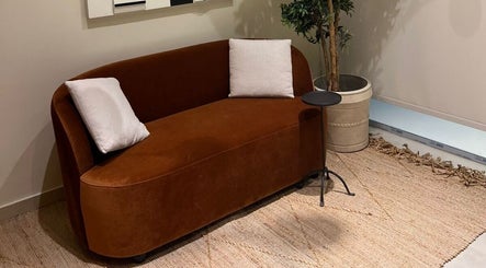 Cozy brown couch in NAY SALON, Riyadh, Riyadh Province, SA, enhancing serene ambiance with decor.