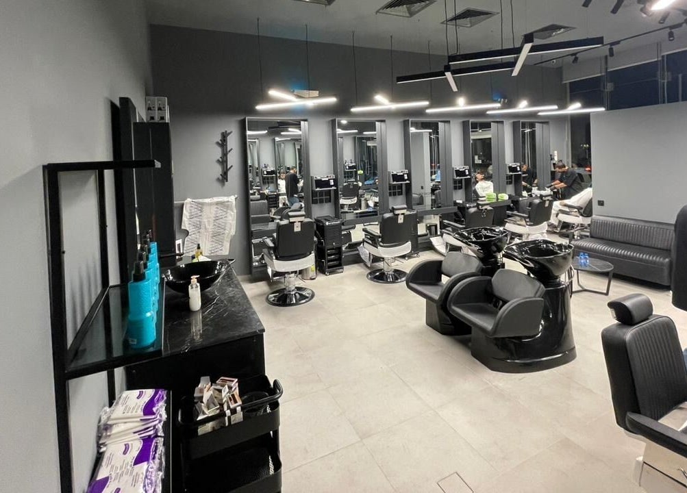Modern, sleek salon at Qurtubah 30 Degrees, Riyadh, Riyadh Province, SA featuring styling stations and seating.