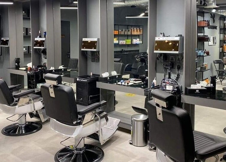 Elegant interior of AlYasmin 30 Degrees salon, Riyadh, Saudi Arabia, SA. Modern barber chairs and mirrors.