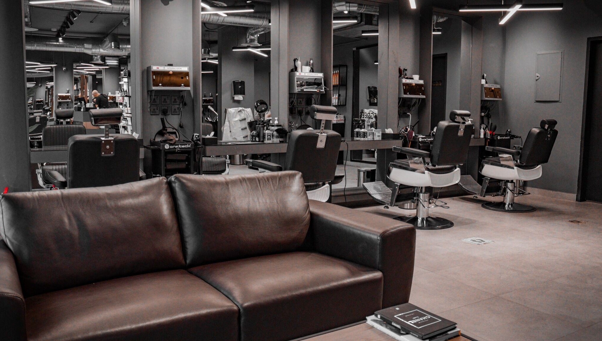 Stylish interior of Al Izdihar 30 Degrees beauty salon in Riyadh, Riyadh Province, SA with modern barber chairs.