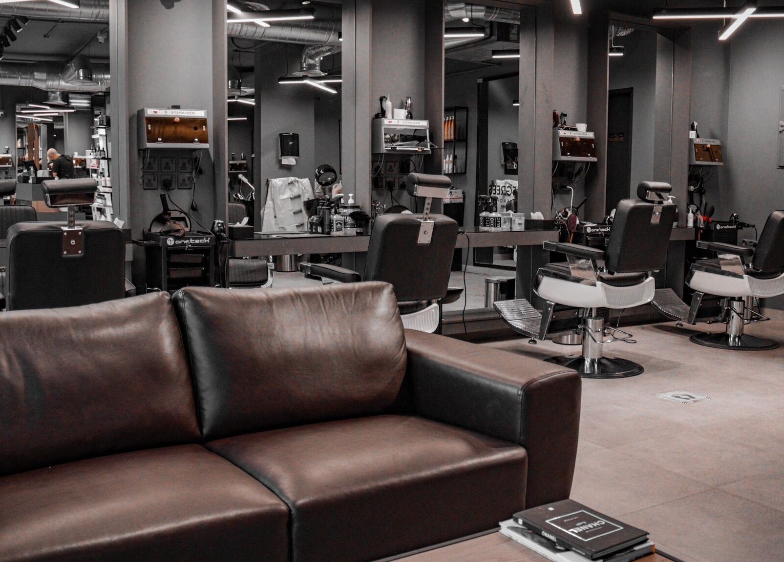 Stylish interior of Al Izdihar 30 Degrees beauty salon in Riyadh, Riyadh Province, SA with modern barber chairs.