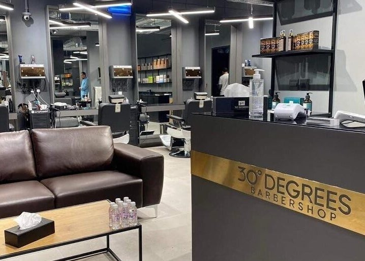 Interior of Al Izdihar 30 Degrees, a sleek barbershop in Riyadh, Riyadh Province, SA, showcasing a modern design.
