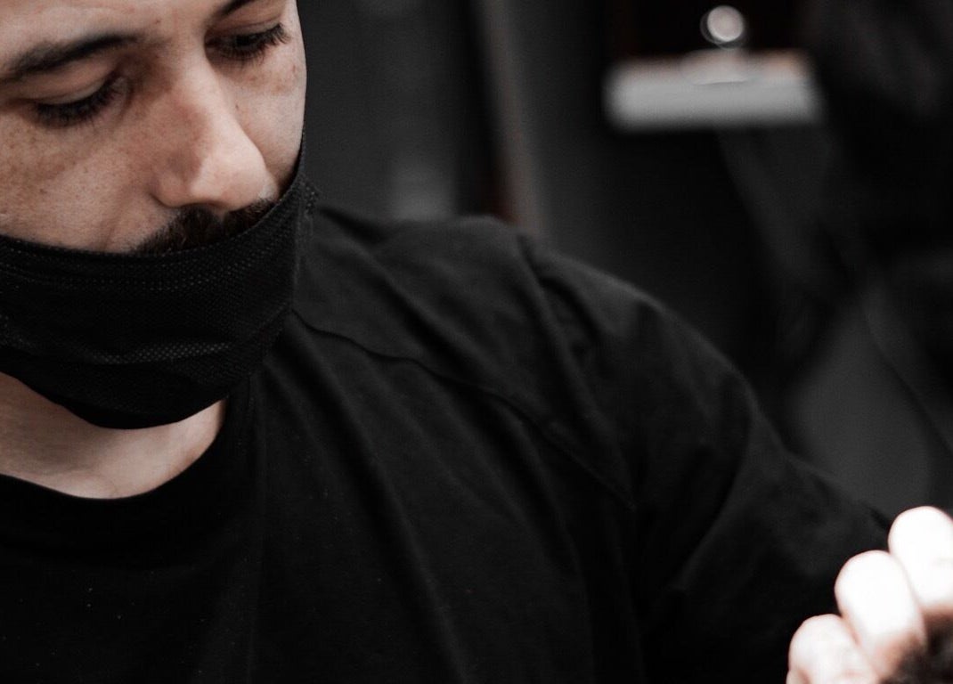 Stylist focusing on a client at Al Izdihar 30 Degrees, Riyadh, Riyadh Province, SA.