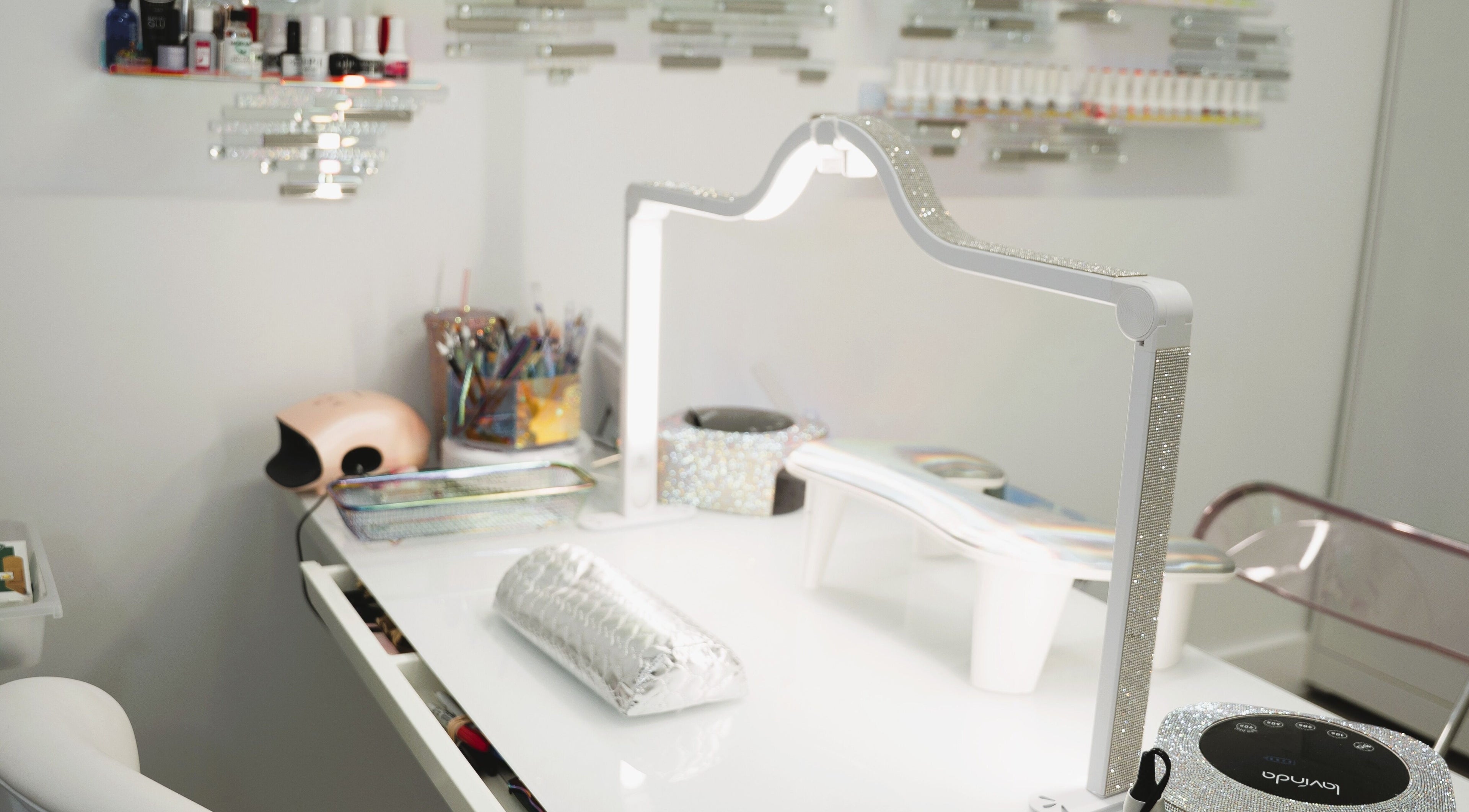 Modern nail station at Bronx Opal, New York, featuring stylish manicure tools.