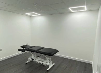 Spacious treatment room at PJ Sports Rehab in Bideford, England, GB with a professional therapy table.