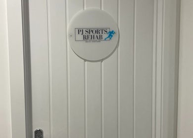 Entrance with PJ Sports Rehab sign in Bideford, England, GB.