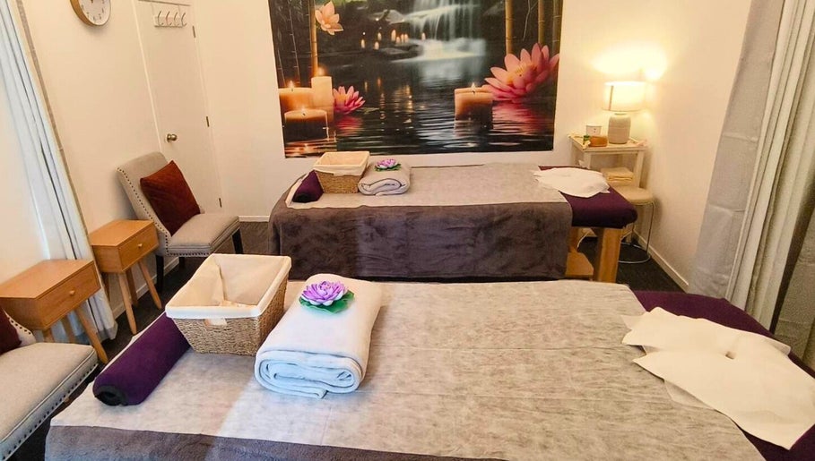 Relaxing massage room at Darawan Thai Massage, Auckland, NZ with candles and soft lighting.
