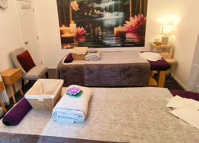 Relaxing massage room at Darawan Thai Massage, Auckland, NZ with candles and soft lighting.