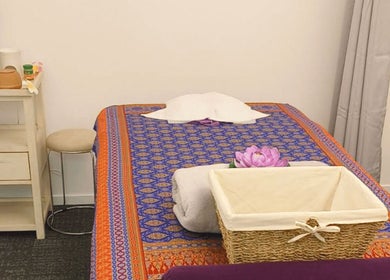 Relaxing massage room at Darawan Thai Massage, Auckland, Auckland, NZ with a vibrant bedspread and calm ambiance.