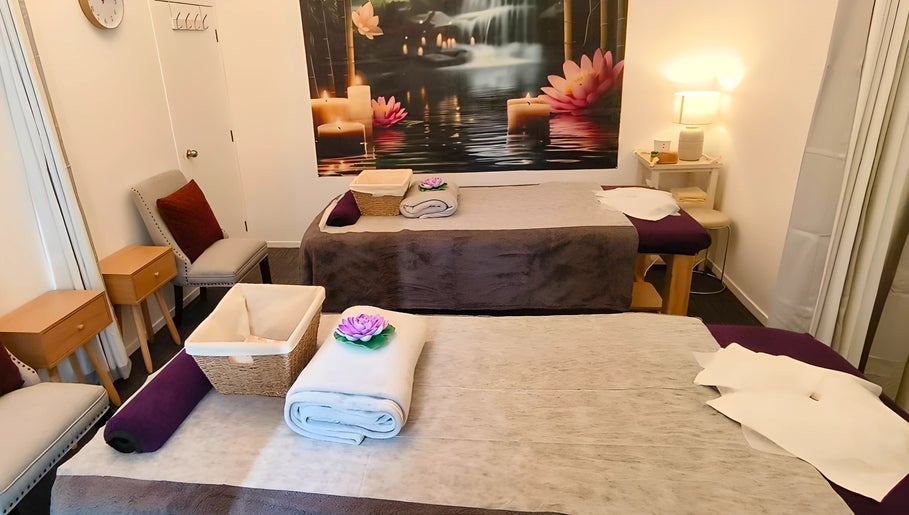 Serene massage room at Darawan Thai Massage, Auckland, NZ, featuring calming decor and prepared massage beds.