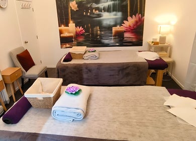 Serene massage room at Darawan Thai Massage, Auckland, NZ, featuring calming decor and prepared massage beds.