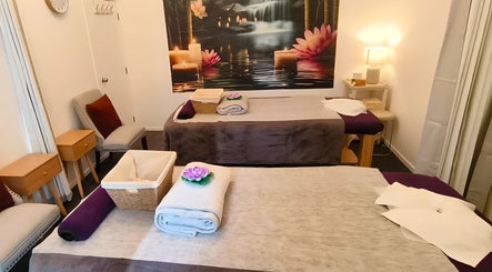 Serene massage room at Darawan Thai Massage, Auckland, NZ, featuring calming decor and prepared massage beds.