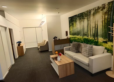 Relaxing lounge at Darawan Thai Massage, Auckland, Auckland, NZ, featuring cozy seating and nature-themed decor.