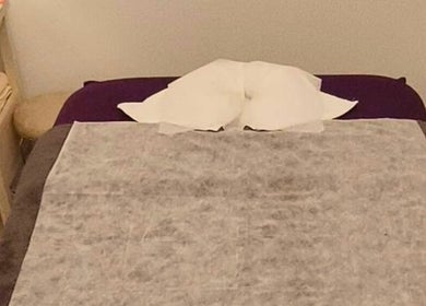 Cozy massage bed at Darawan Thai Massage, Auckland, Auckland, NZ offering a tranquil relaxation space.
