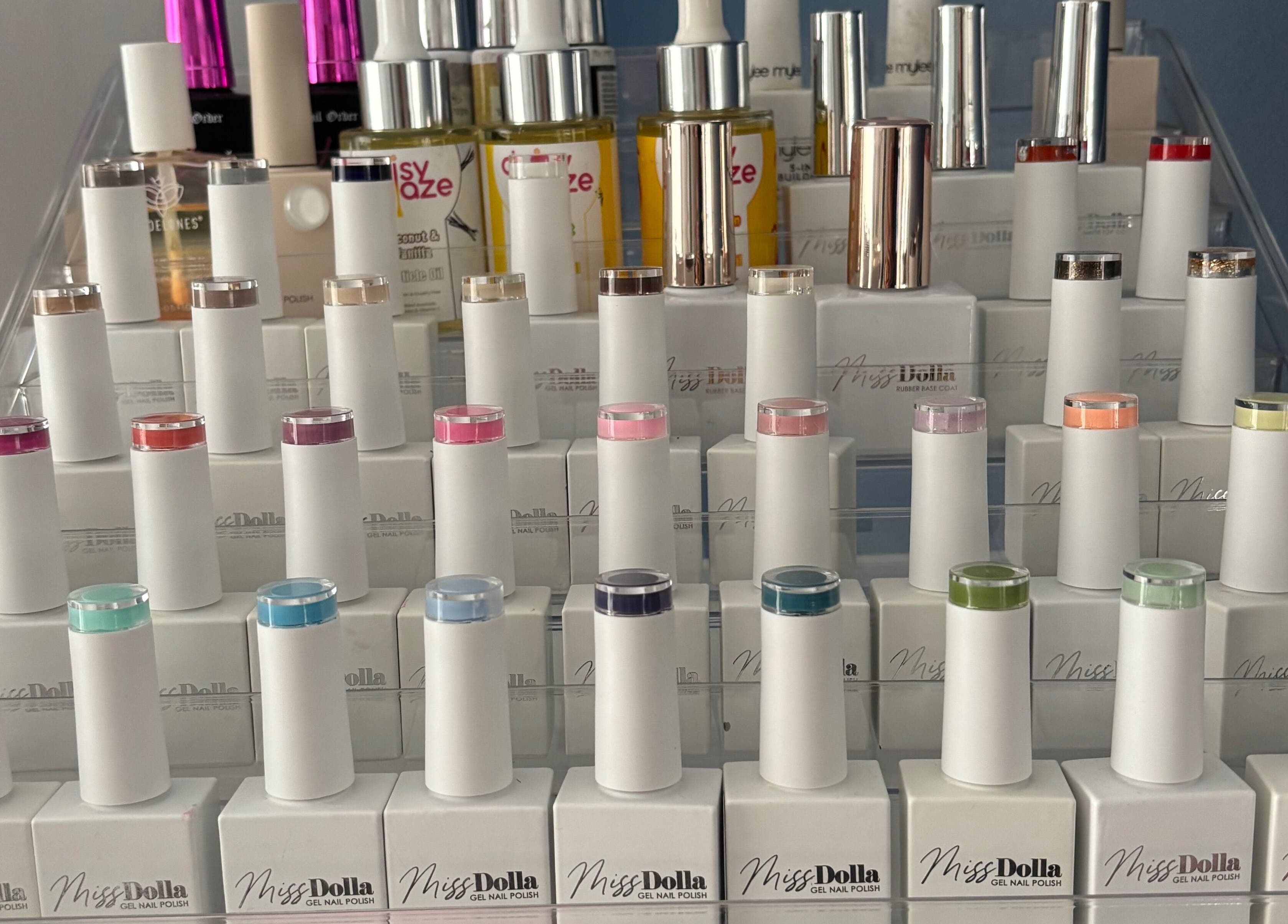 Colorful nail polish array at Torvelle Beauty in Churchdown, England, GB showcasing vibrant beauty options.