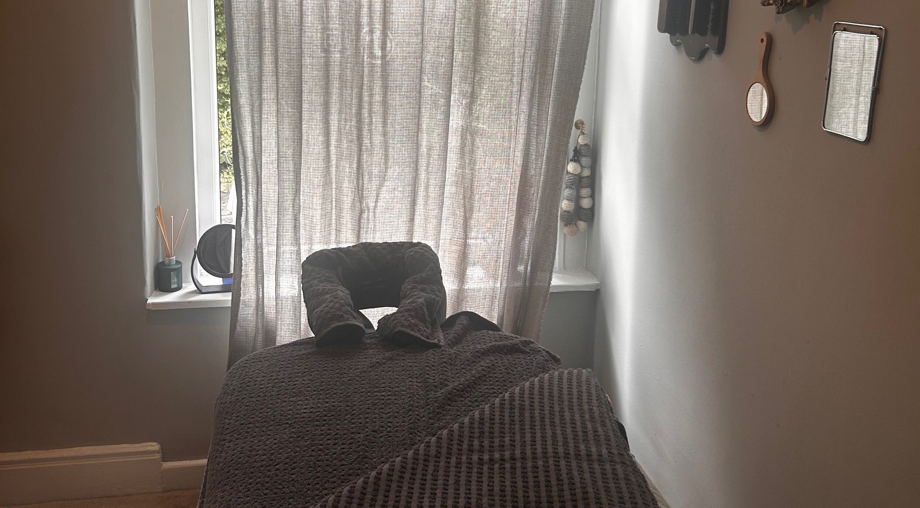 Relaxing massage room at Bethesda Beauty in Rawdon, England, GB featuring a comfortable treatment bed.