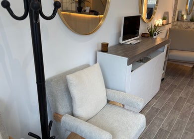 Modern reception area with chairs and mirrors at Lashedbycourtxx, Stalybridge, England, GB.