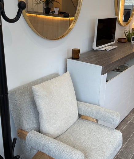 Modern reception area with chairs and mirrors at Lashedbycourtxx, Stalybridge, England, GB.