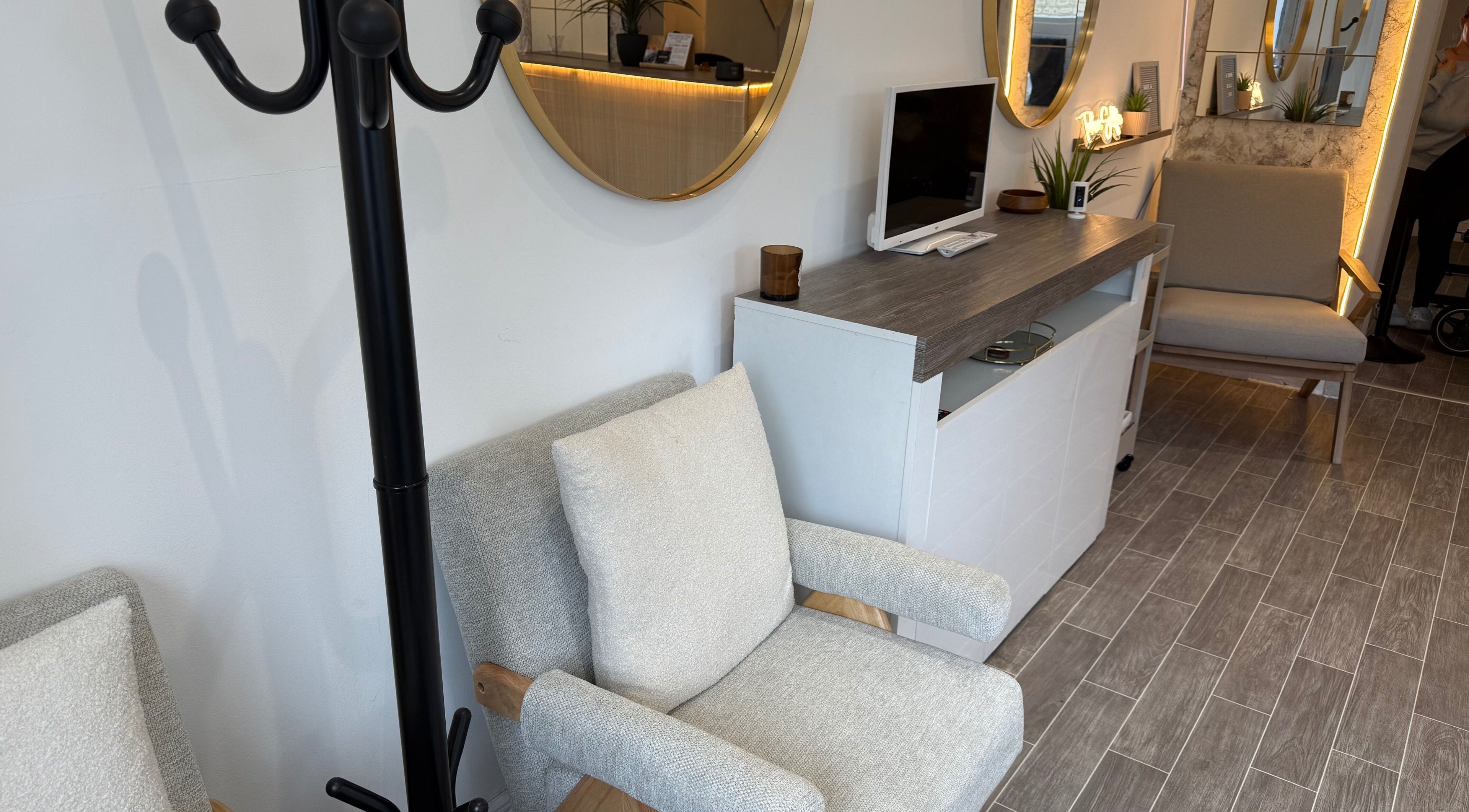 Stylish seating area at Lashedbycourtxx, Stalybridge, England, GB, featuring modern decor and cozy chairs.