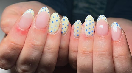 Polka dot nail art at EM Nails in Belfast, Northern Ireland, GB showcasing creative manicure style.