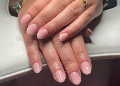 Elegant pink manicure at EM Nails, Belfast, Northern Ireland, GB showcasing professional nail care.