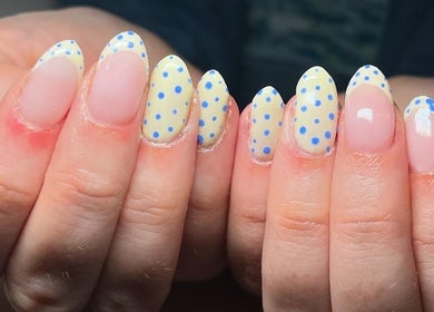 Stylish polka dot manicure by EM Nails, Belfast, Northern Ireland, GB. Perfect for a fun and trendy look.