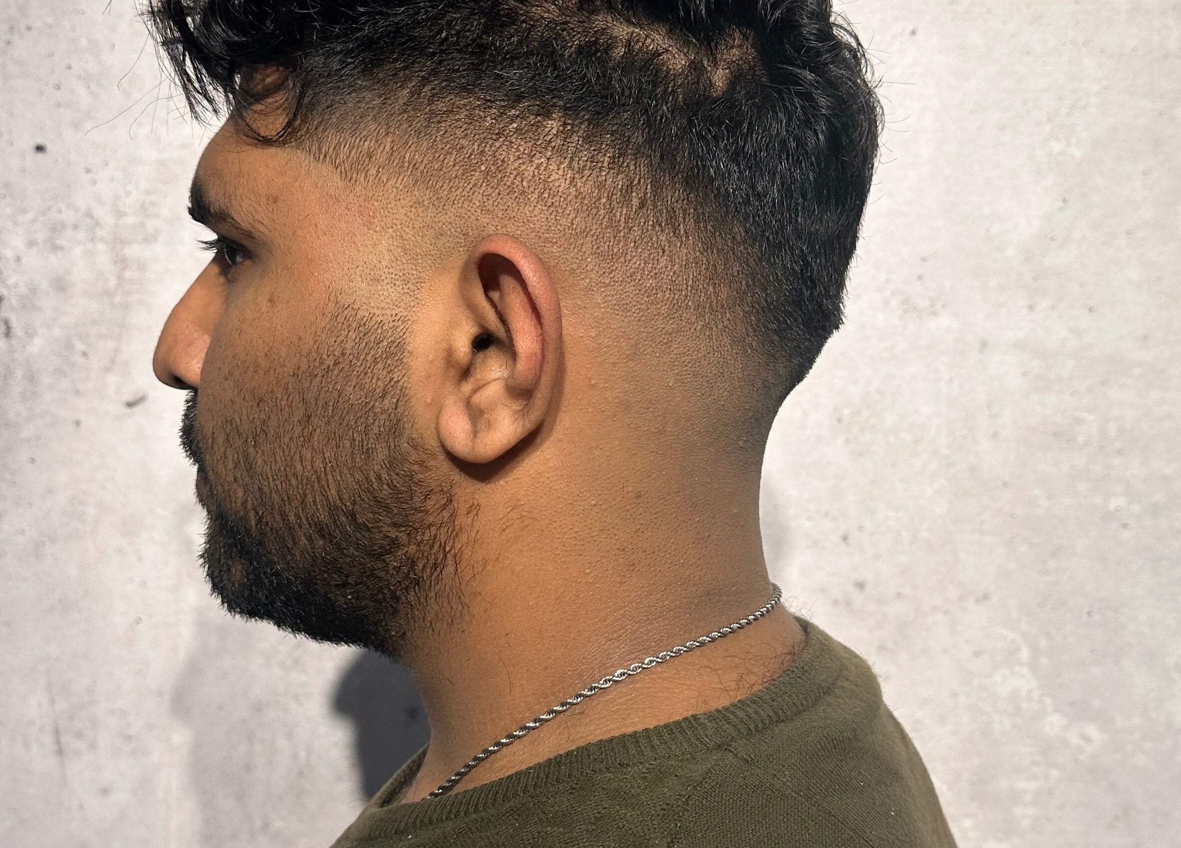 Side view of a man's sleek fade haircut at Noble Blendz, Melbourne, Victoria, AU.