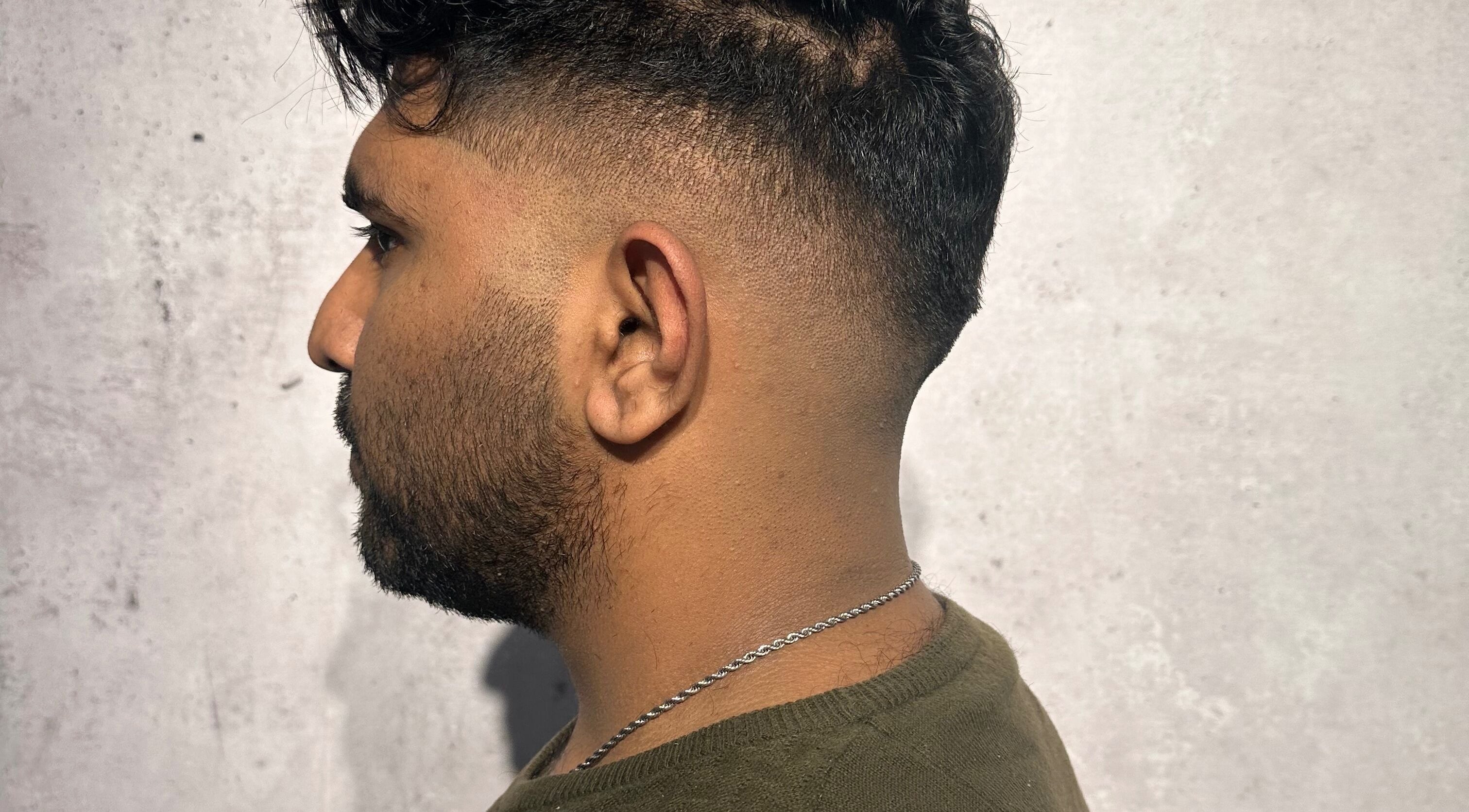 Side view of a man's sleek fade haircut at Noble Blendz, Melbourne, Victoria, AU.
