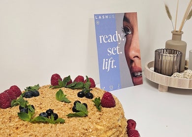 RC BeautyLab in Manchester, England, GB displays a cozy setup with a decorative cake and candles.